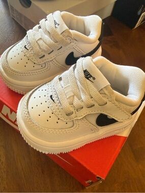 Nike Kids White Sneakers with Black Swoosh